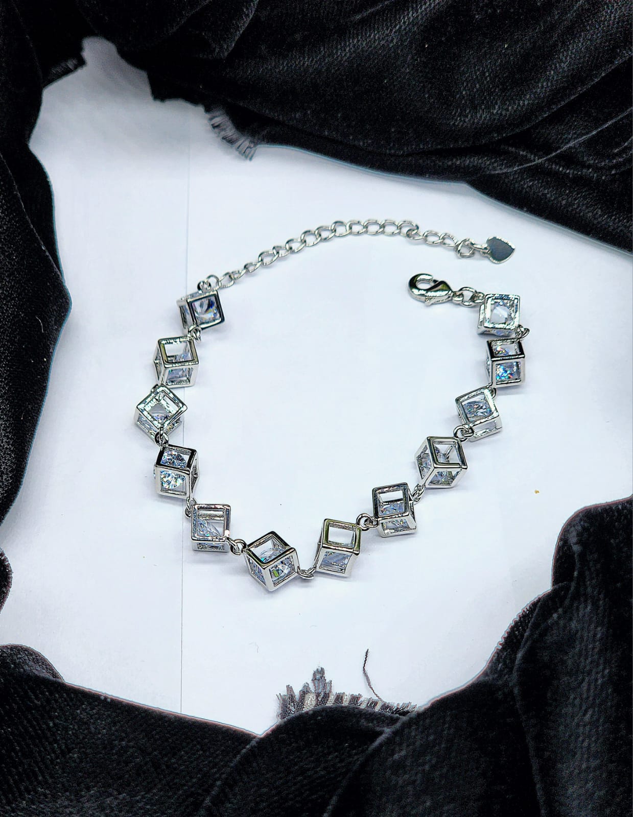 Silver-Toned Cubic Zirconia Link Bracelet.